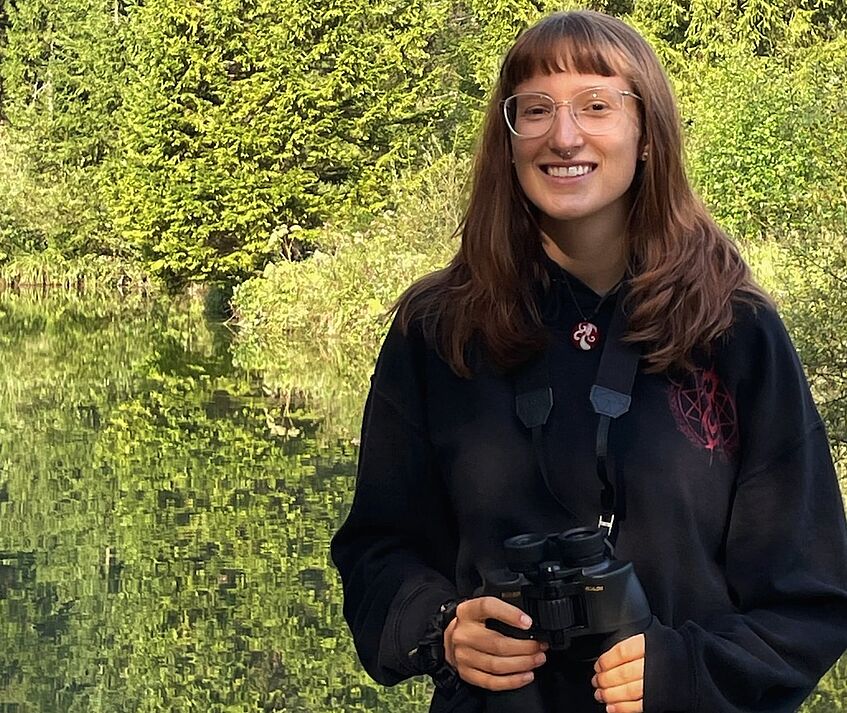 portrait of a young woman with binoculars