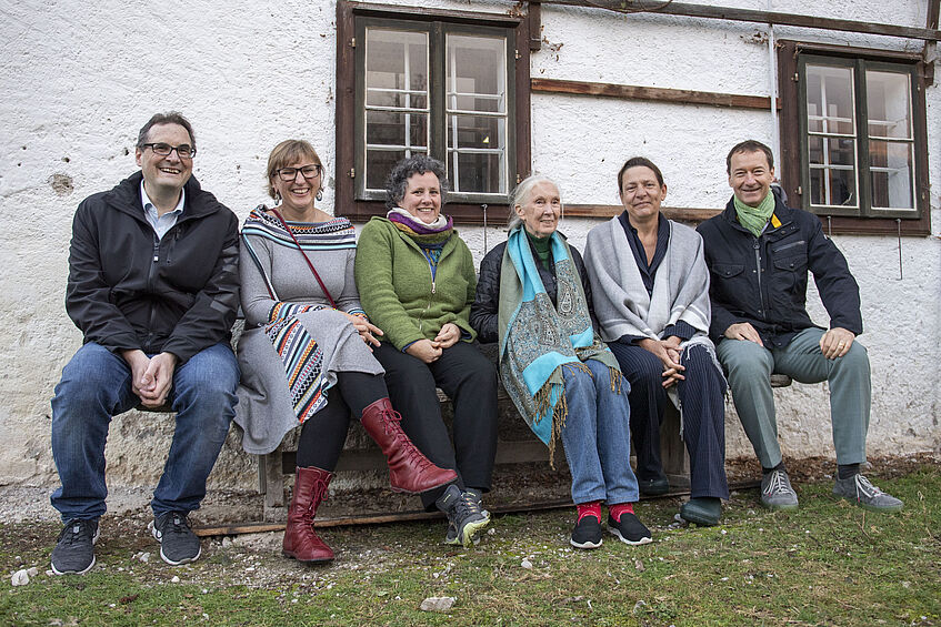 group picture in front of an old building (5 people including Jane Goodall)