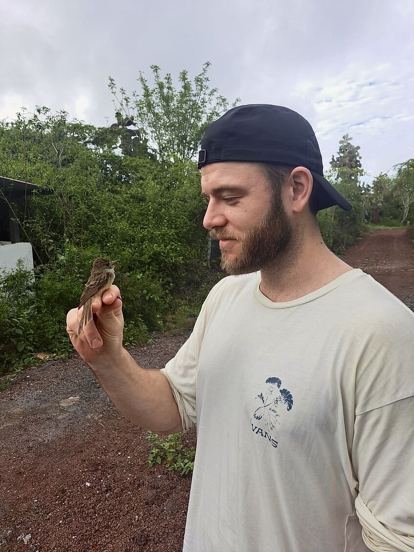 man with songbird in hand