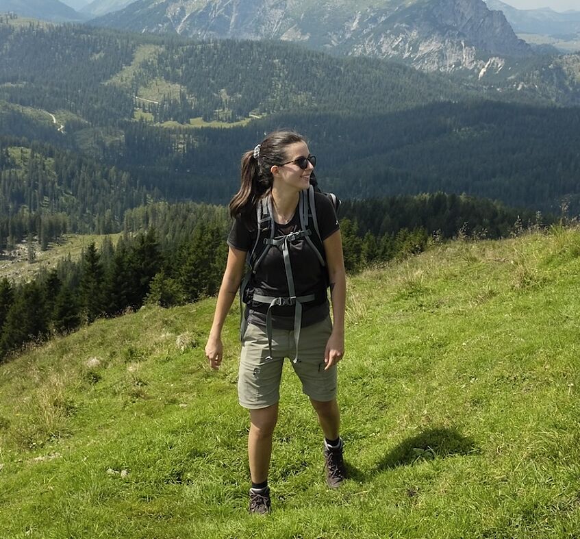 young woman hiking in the mountains